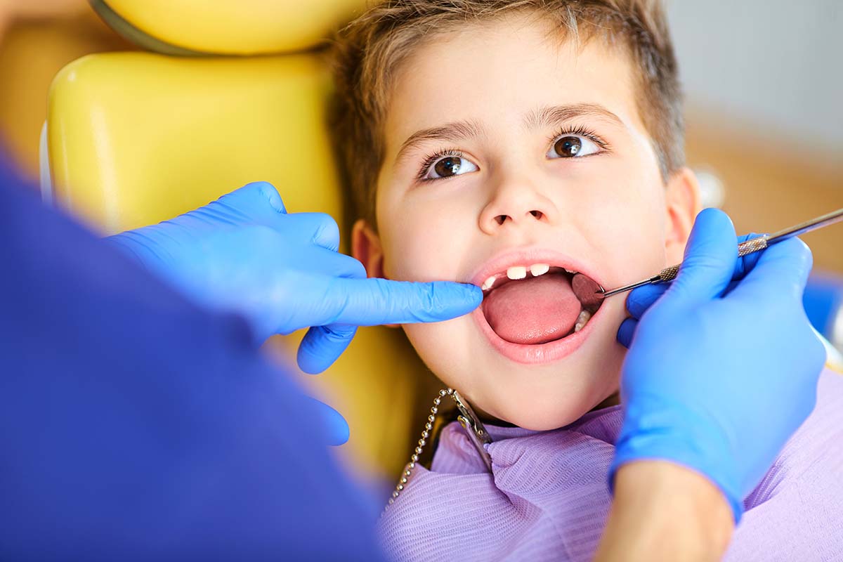 child visiting the dentist after parents asked when should I take my child to the dentist