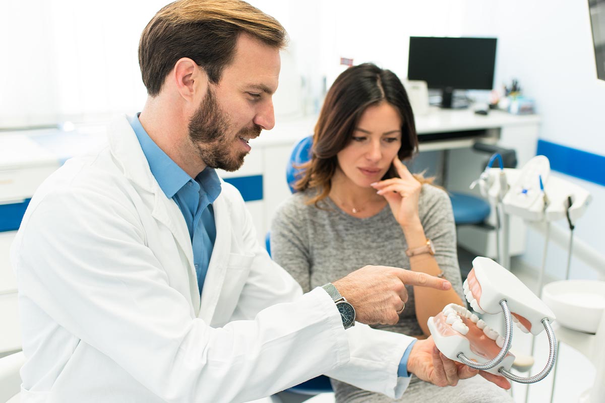 a woman learns about dental implants