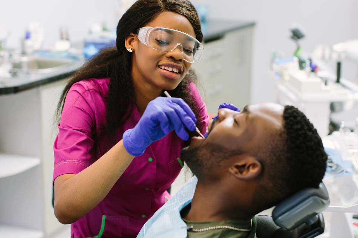 dentist helping patient prevent teeth shifting