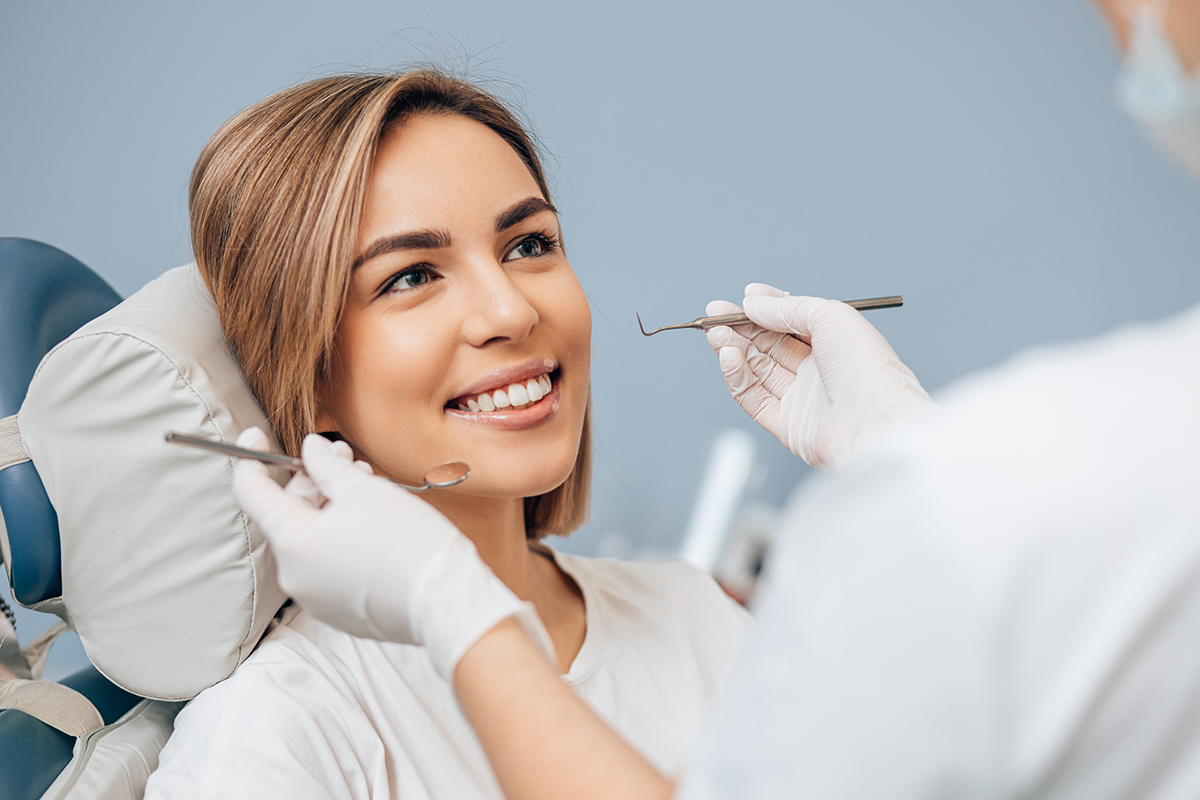 dentist working on patient treating a chipped tooth