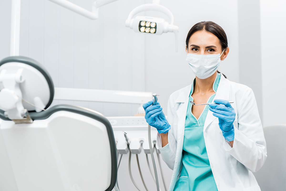 dentist with instruments if you have dental insurance