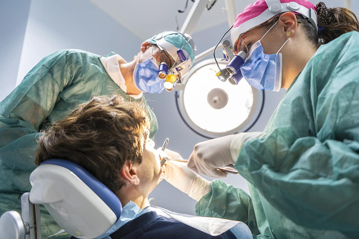 young man getting oral surgery