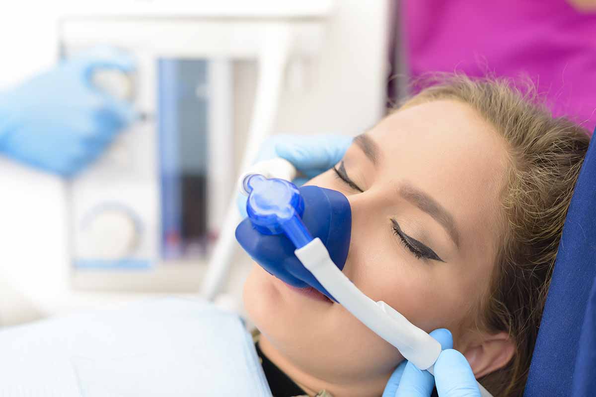 woman receives sedation dentistry services