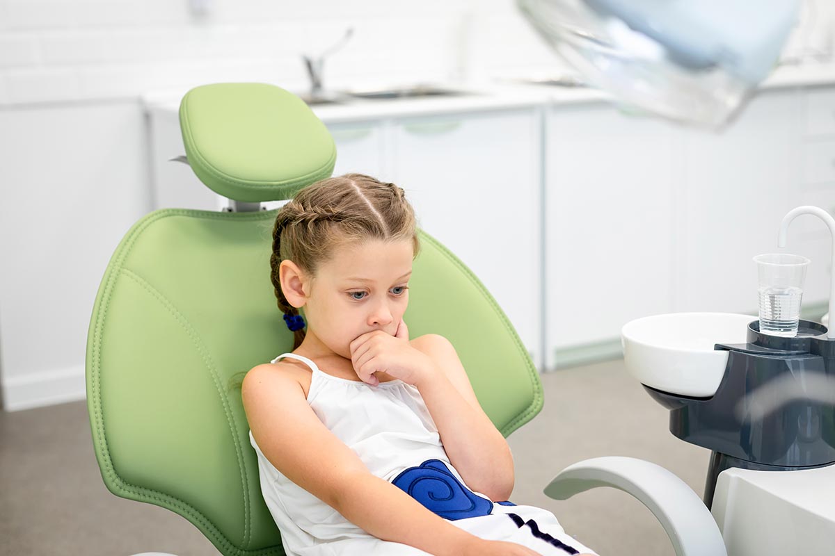 young girl struggles with child's dental anxiety