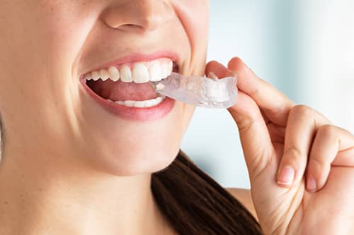 woman struggling with teeth grinding