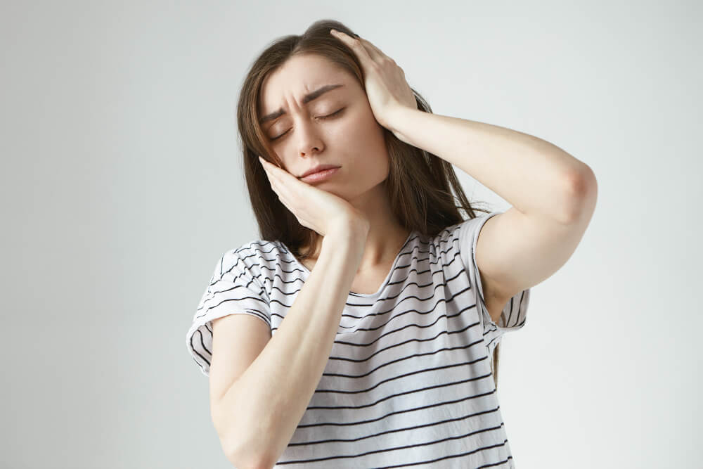 woman with a toothache and headache