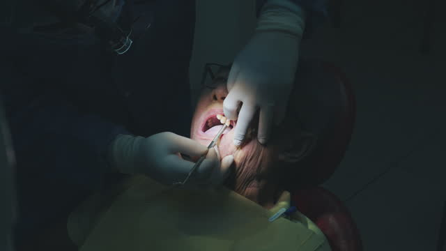 an image of a dental procedure done under a dental light